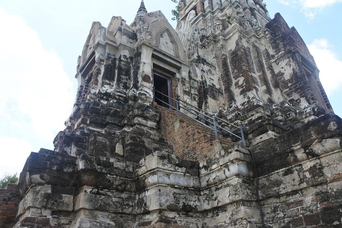 A Day in Ayutthaya: Private 5 UNESCO Temples Tour From Bangkok - Wat Ratchaburana: The Temple of the Royal Restoration and the 1957 Looting Story