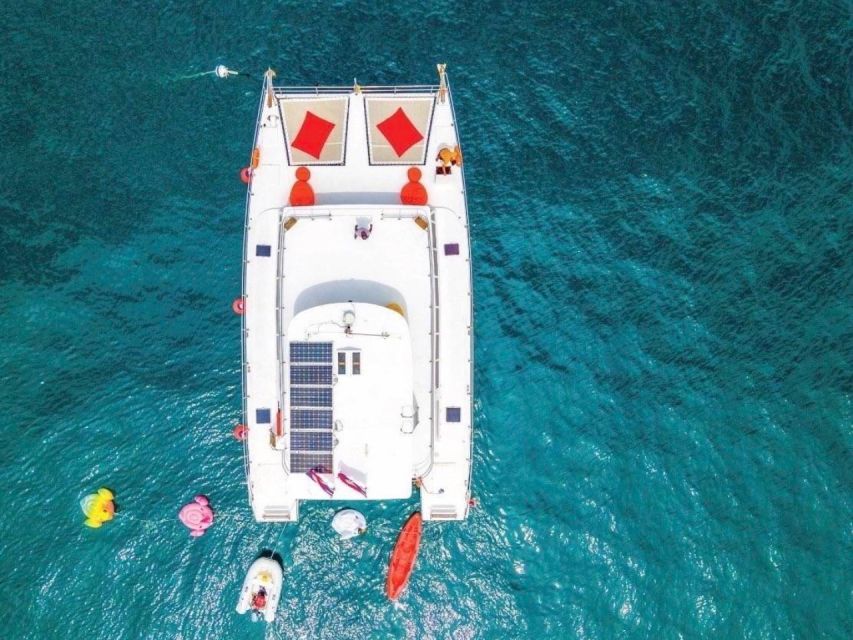 Amazing Coral Island & Sunset Dinner with Power Catamaran - Coral Island: beach time, snorkeling gear, and fun on calm water