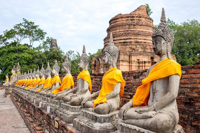 Ayutthaya Sunset Tour: Iconic Temples & Scenic River Boat Ride - Temple stop 2: Wat Mahathat, the famous Buddha head in roots