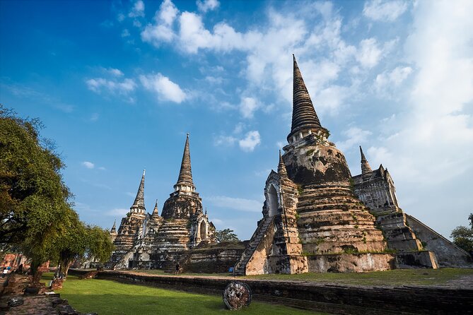 Ayutthaya Temples and River Cruise from Bangkok - Wat Mahathat: the tree roots, the prang, and a 30-minute must-see