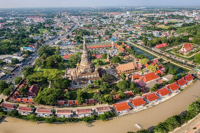 Ayutthaya UNESCO Temples Group Tour with Lunch - Wat Mahathat and the famous Buddha head in Bodhi tree roots