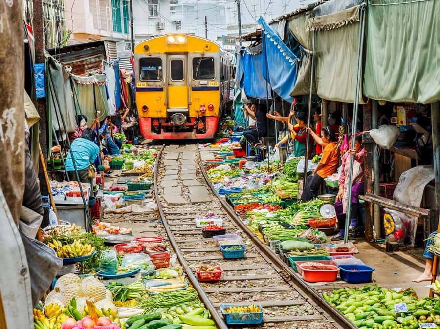 Bangkok: Damnoen Saduak and Ayutthaya Private Day Trip - Maeklong Railway Market: the umbrella-folding scene in the last seconds