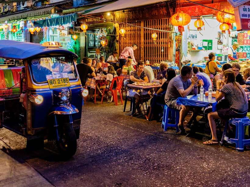 Bangkok: Evening Tour with Wat Arun, Wat Pho & Tuk Tuk Ride - Ferry to Wat Arun: porcelain and seashell details in the evening light