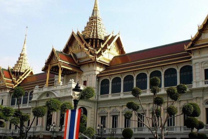 Bangkok Grand Palace Tour with Convenient Hotel Transfer - Wat Phra Kaew and the Emerald Buddha stop that stays within the palace grounds