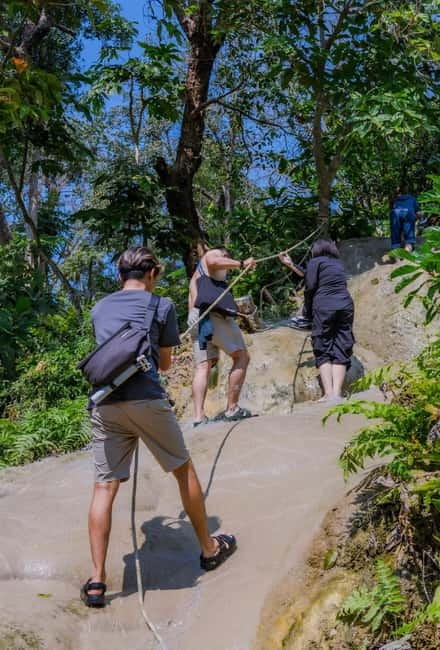 Chiang Mai: Sticky Waterfall & Angel Waterfall Park Day Tour - Sticky Waterfall climbing on mineral-rich limestone