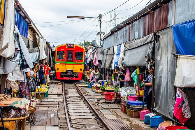 Damnoen Saduak Floating Market and Maeklong Railway Market Tour - Wat Bang Kung: banyan-root chapel for a calm reset