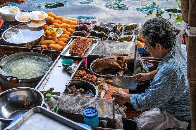 Damnoen Saduak Floating Market & Maeklong Railway Market Tour From Bangkok - Stop 1: Damnoen Saduak Floating Market and the canal-borne market life