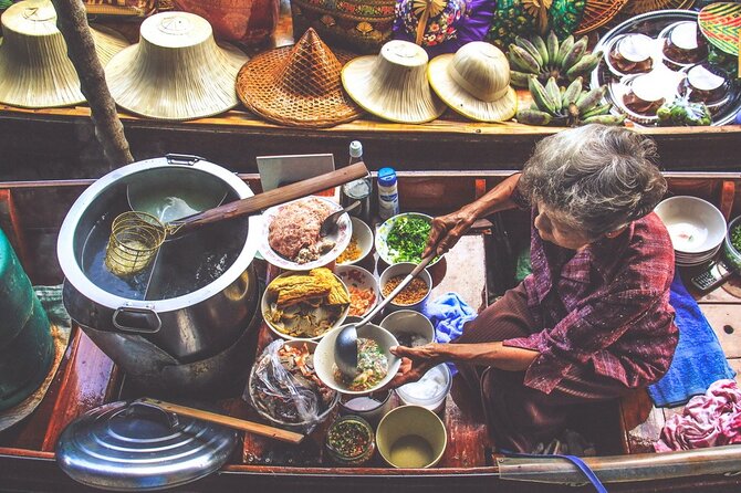 Damnoen Saduak Floating Market & Maeklong Railway Market Tour From Bangkok - Stop 2: Mae Klong Railway Market, aka Hoop Rom, where trains control the shopping