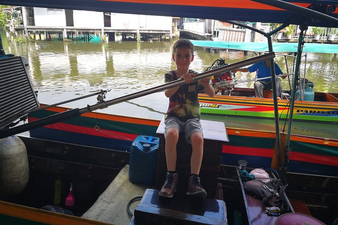 Explore Bangkok by Bike & Boat with Lunch - Wat Ko and the rooster temple moment: feed fish, get the karma vibe