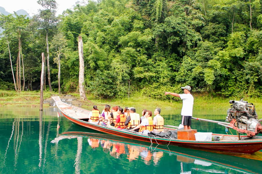 From Khao Lak: Full-Day Cheow Lan Lake with Cave Tour - Rajjaprabha Dam by long-tail boat, where speed meets big views
