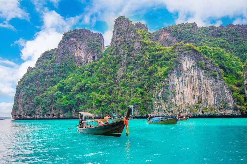 From Phi Phi islands: Phi Phi, Maya Area by longtail Boat - Monkey Beach and Viking Cave: quick stops with big visual payoff