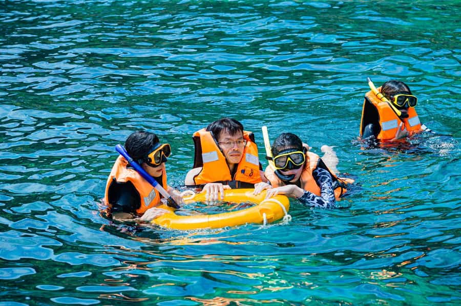 From Phuket: Coral Island Kahung Beach Speedboat Trip - Kahung Beach Setup: Beach Chairs, Fruit, and Snorkel Gear
