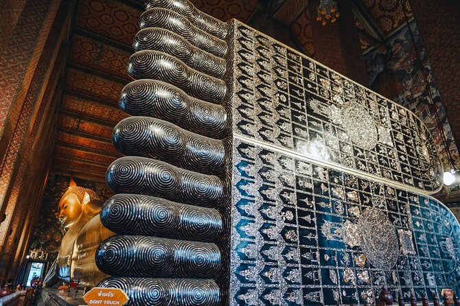 Grand Palace, Wat Phra Kaew, Wat Pho and Wat Arun Walking Tour From Bangkok - Stop 3: Wat Pho, the Reclining Buddha and Thai massage origins