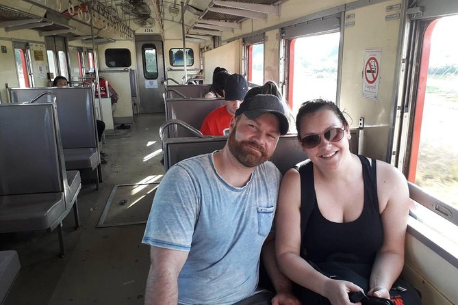 Half-Day Railway Market and Floating Market Tour in Thailand - The Damnoen Saduak stop: longtail boat cruising and canal-side shopping