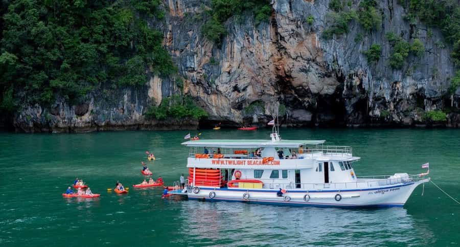 Khao Lak: Twilight Sea Canoe and Glowing Plankton Tour - Cave kayaking in Phang Nga Bay: limestone rooms and wildlife sightings