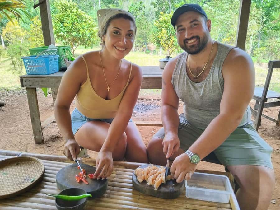 Khao Sok: Private Bamboo Rafting & Jungle Cooking Adventure - Bamboo rafting in Khao Sok jungle, with fish feeding