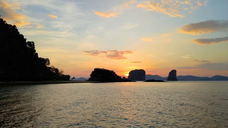 Ko Yao Yai: Hong Island & Plankton Longtail Boat Sunset Tour - Koh Nok Beach Stop: Cliffs, Trees, and a Quick View Fix
