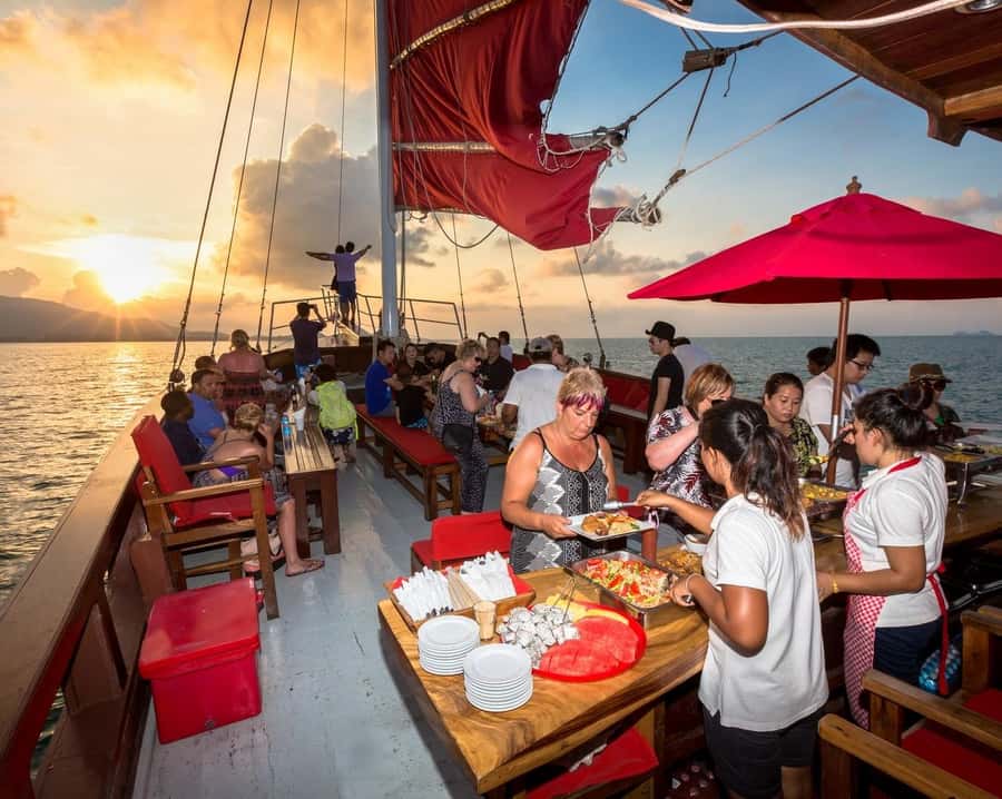Koh Samui: Red Baron Romantic Sunset Dinner Cruise - Onboard bar and hosts: comfort, language, and a calmer vibe