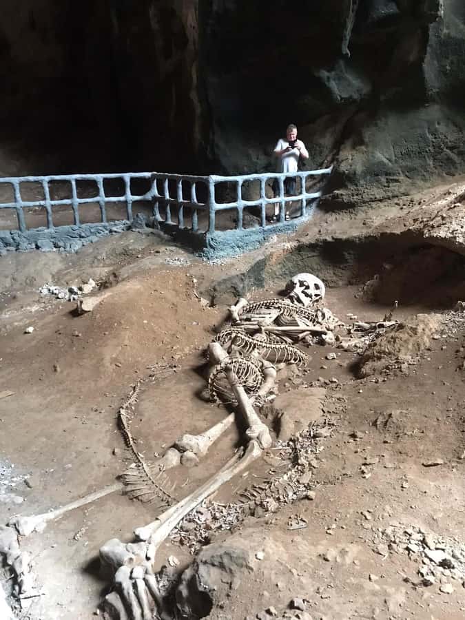 Krabi: Half-Day Mangrove Boat Trip And Khao Khanap Nam Cave - The Khao Khanap Nam Cave stop, paintings, and the bones