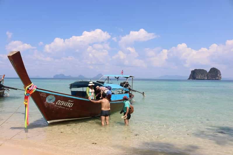Lanta's Hidden Gems: 4 Islands by Traditional Longtail Boat - Koh Chueak snorkeling stop: clear water and small karst scenery