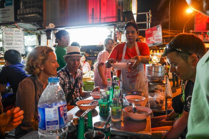 Night Street Food Tour of Bangkok's Chinatown - Wat Tri Mitr: a landmark pause that actually fits the story