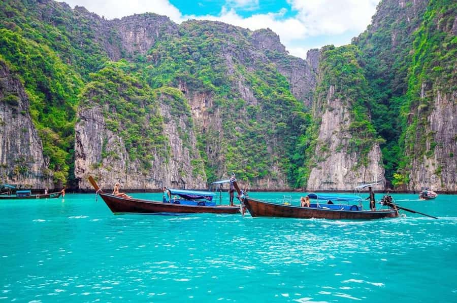 Phi Phi Islands: 2 Days, 1 Night Trip with Activities - The Long-Tail Boat Day: Maya Beach, Pileh Lagoon, Caves, and Swimming