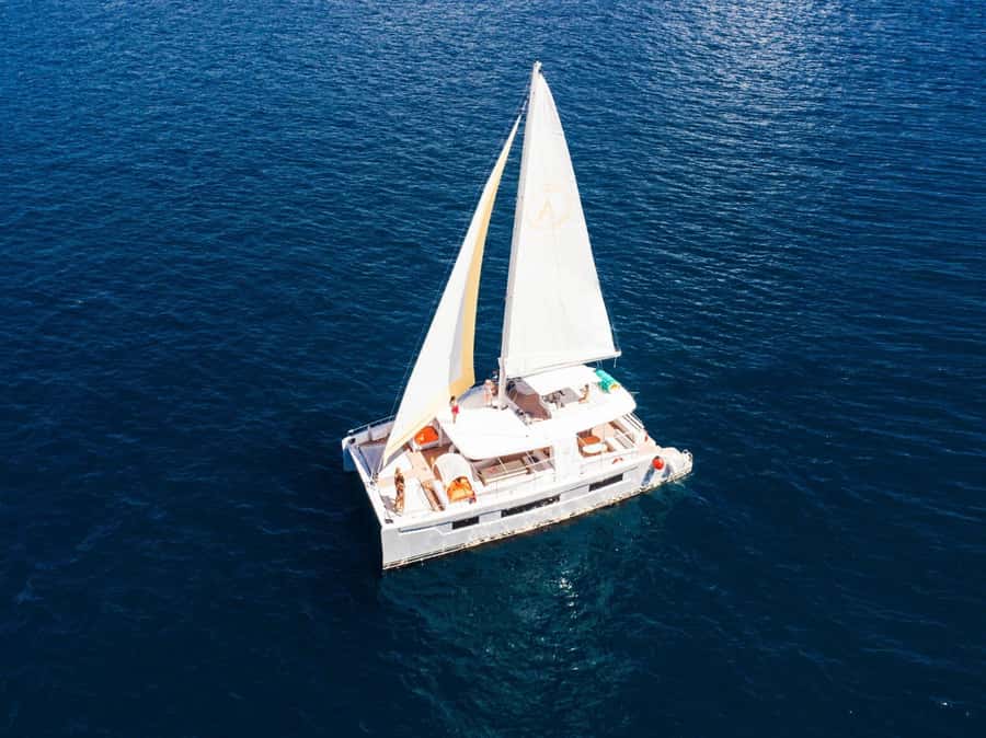 Phuket: Coral and Racha Island Yacht Tour with Lunch - What the Return Cruise Really Delivers: Snacks, Sushi, and Cape Panwa Sunset Photos