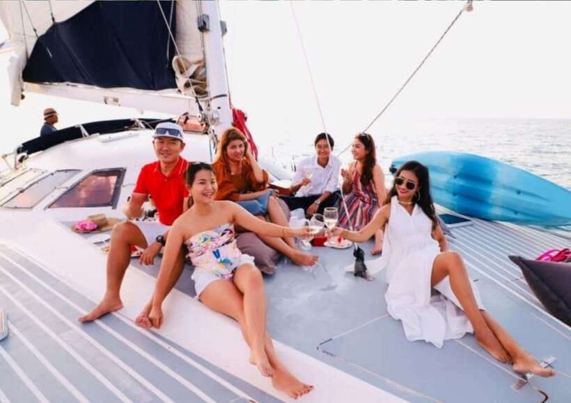 Phuket: Coral Island Catamaran Cruise with Sunset Dinner - Sunset sailing at Promthep Cape, with Thai dinner on board
