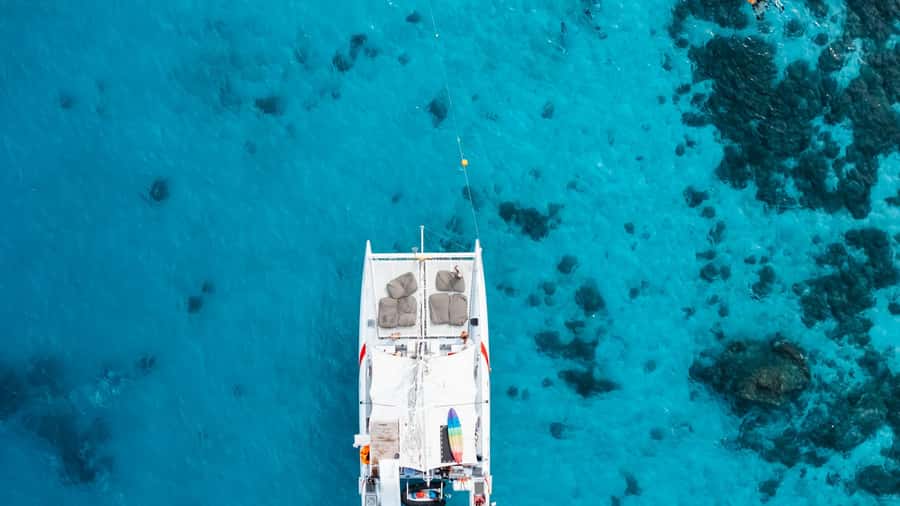 Phuket: Coral, Racha, Promthep Island Catamaran Trip & Lunch - Boat Crew, Guides, and How the Day Runs