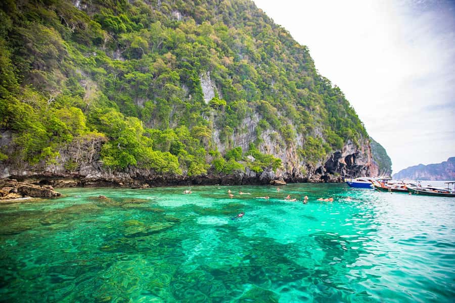 Phuket: Maya Bay, Phi Phi, Green, and Khai Islands Day Trip - Getting to the marina: van ride, AA Marina break, and timing reality