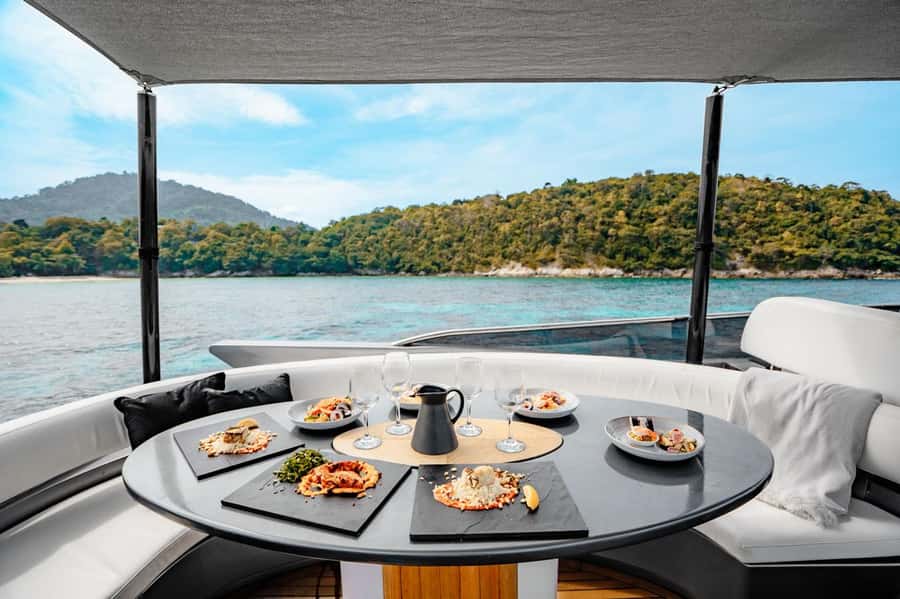 Phuket: Phi Phi Island & Maya Bay Luxury Yacht Day Tour - What Happens During the 1.5-Hour Cruise Out to the Maya Bay Area