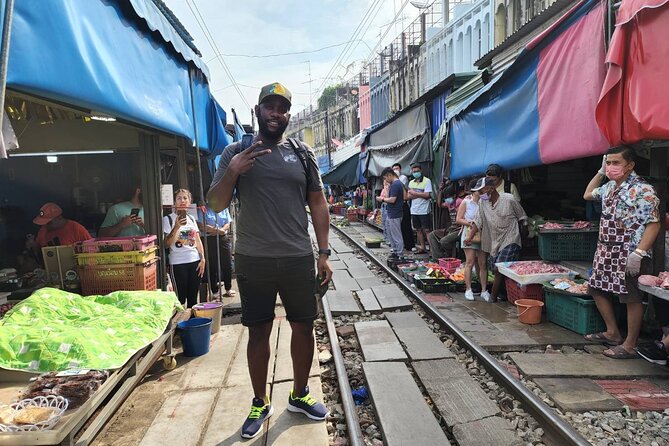 Private Amphawa & Maeklong Railway Market Day Tour with Fireflies - Mae Klong Railway Market, where stalls and rails share the same space
