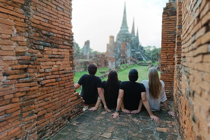 PRIVATE Ayutthaya + SUNSET Boat Tour + Light up The NIGHT - Wat Mahathat and the headless Buddha atmosphere