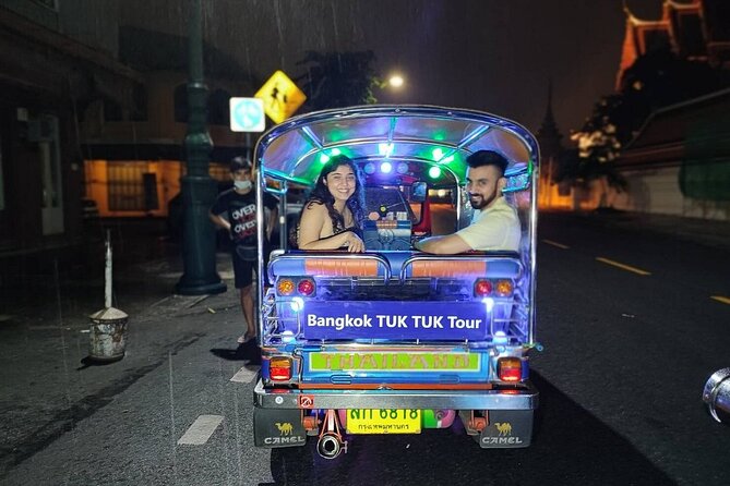 Private Bangkok Night City Tour by Tuk-Tuk with Thai Food - Wat Arun after dark: one of the few times you should see it lit up