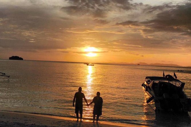 Railay and 4-Island Sunset Speedboat Cruise with Night Snorkel - Limestone chicken-shaped island and the Railay Bay cliff photo moment
