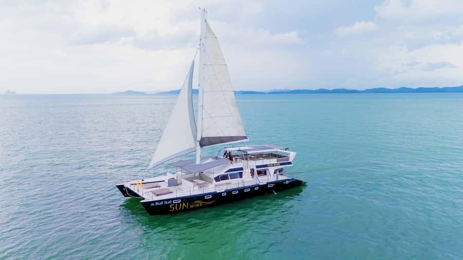 SUNWIND Phuket: Coral and Racha Islands Catamaran Tour - SUNWIND Catamaran Comfort: Sun Deck, Shower, DJ, and On-Board Gear