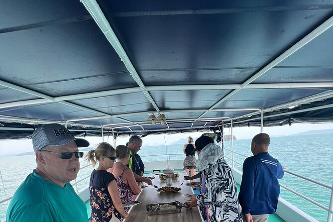 Twilight Sea Canoe Tour with Sea Cave Kayaking in Phang Nga Bay - Stop 4: Ao Phang Nga National Park, lunch onboard and firefly time